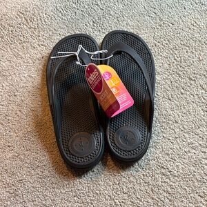 Black flip flops, new with tags